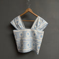 Top broderie bleu ciel